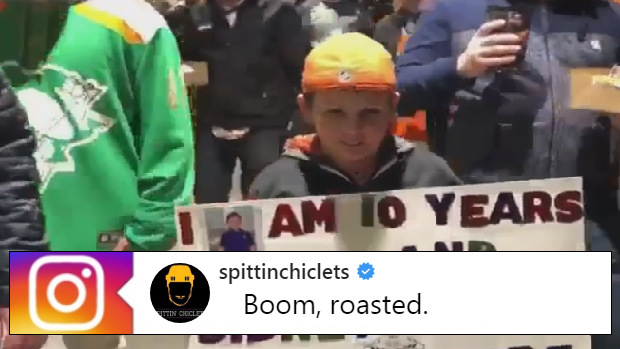 A Philadelphia Flyers fan holds a sign mocking Sidney Crosby on Wednesday night.