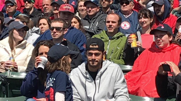 Joe Kelly, suspended Boston Red Sox pitcher, watches from bleachers