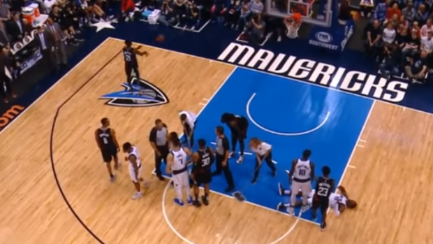 Patrick Beverley throws ball at Mavs fan