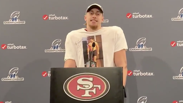 George Kittle wears signed, autographed image of shirtless Jimmy Garoppolo  to news conference