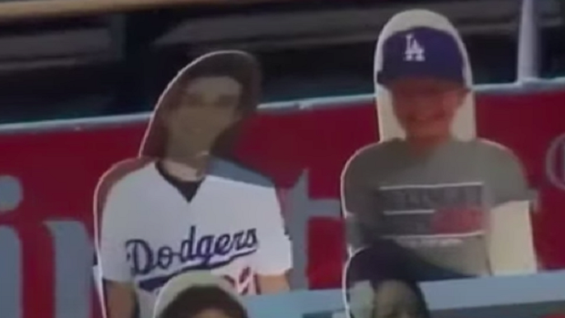 Dodgers' Will Smith reaches out to fan behind destroyed cardboard