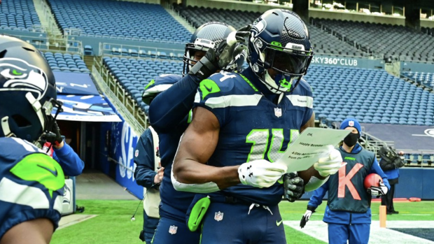 DK Metcalf of the Seattle Seahawks stretches during pregame warmups News  Photo - Getty Images