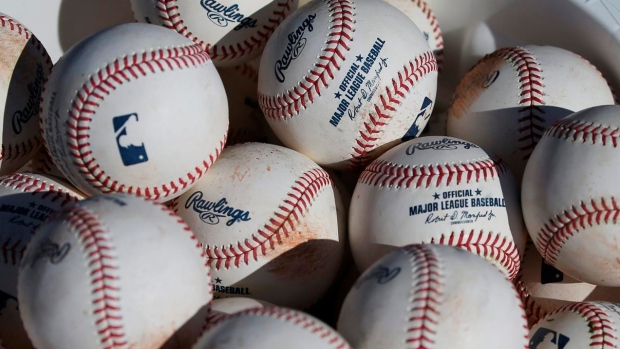Major League Baseball agrees to pay minor leaguers $185 million to