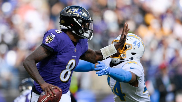 Baltimore Ravens star Lamar Jackson sets NFL quarterback record with ...