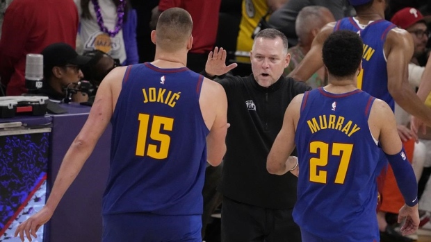 Nikola Jokić and Jamal Murray celebrate