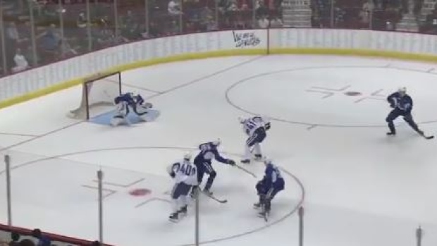 Elias Pettersson scores during the Canucks' Summer Showdown prospects game.