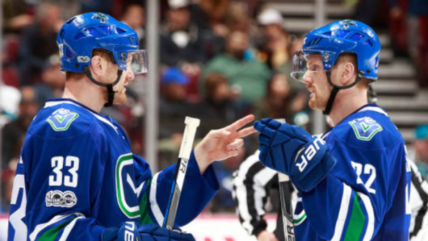 The Sedin twins during a 2017 NHL regular season game.